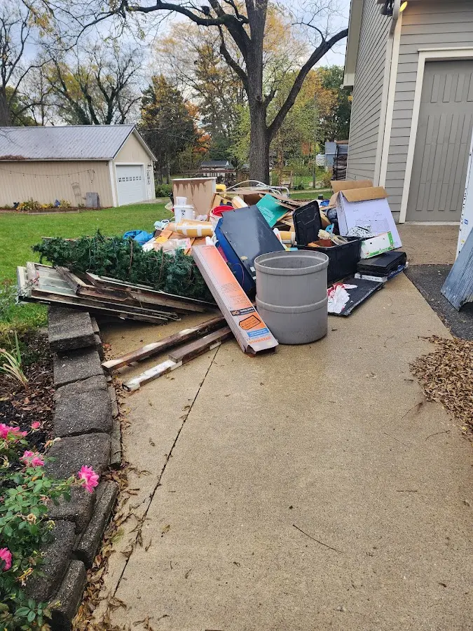 Dumpster being loaded with debris for 10 Yard Dumpster Rental in Hercules